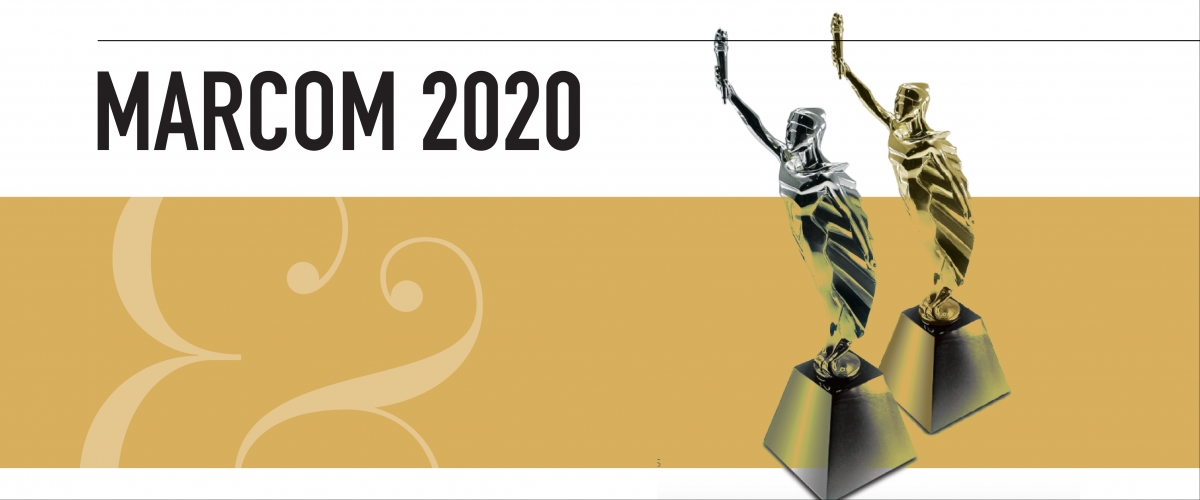 Text reads MarCom 2020. There is a white and gold rectangular background. Two award figures, one gold, one silver, are on the right hand side.
