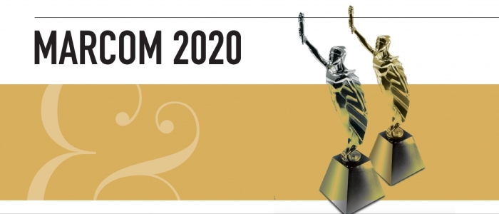 Text reads MarCom 2020. There is a white and gold rectangular background. Two award figures, one gold, one silver, are on the right hand side. 